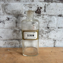 Load image into Gallery viewer, Vintage Apothecary Bottle "SERUM" - Glass Pharmacy Jar with Stopper - Gold Label