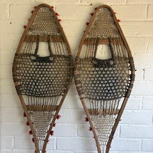 Load image into Gallery viewer, Antique Canadian Huron Wooden Snowshoes - Rawhide & Red Wool Pompoms - c.1930s