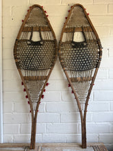 Load image into Gallery viewer, Antique Canadian Huron Wooden Snowshoes - Rawhide & Red Wool Pompoms - c.1930s