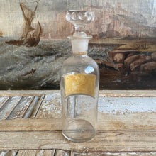 Load image into Gallery viewer, Antique Glass Pharmacy Bottle with Reverse Glass Label - Ol. Sassaf.
