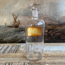 Load image into Gallery viewer, Antique Glass Pharmacy Bottle with Reverse Glass Label - TR. Rhei Co.
