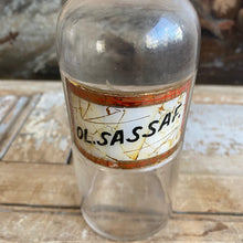 Load image into Gallery viewer, Antique Glass Pharmacy Bottle with Reverse Glass Label - Ol. Sassaf.
